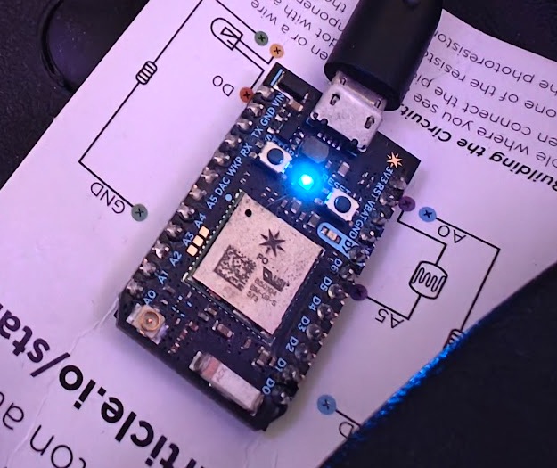 Particle Photon in all-clear blue. Also still on the getting-started guide.